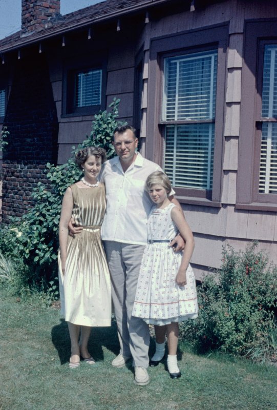 Two Women by the House