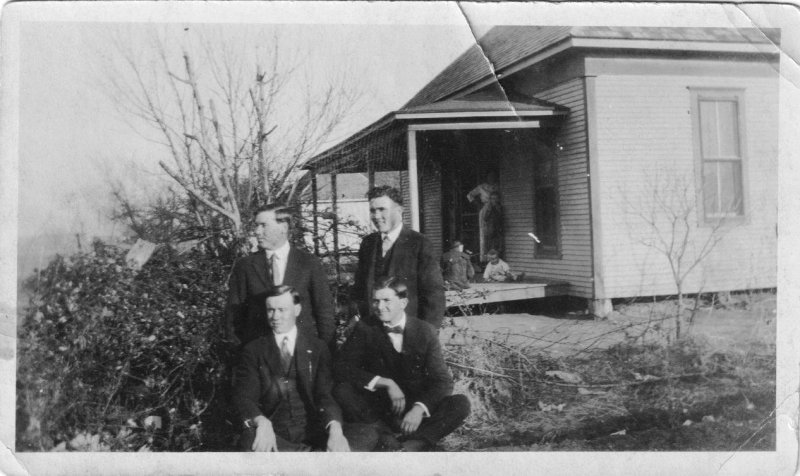 Four Men by the Porch
