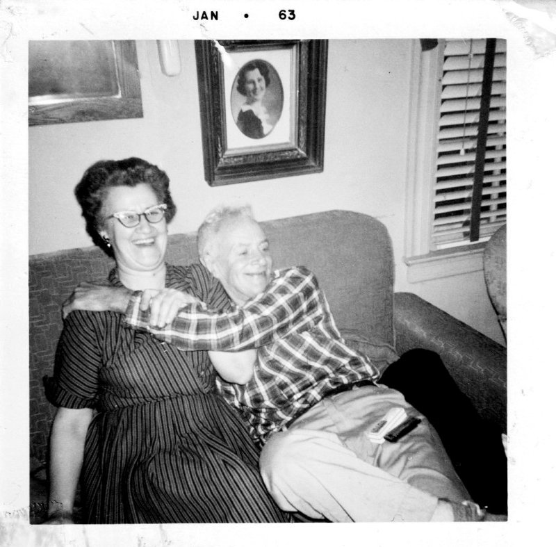 The Laughing Couple on the Sofa